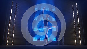 Theatrical ballet performance performed by young ballet dancer in white tutu. Silhouette of young slender woman dancing