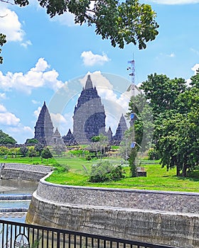 The Prambanan Temples rise magnificently under the blazing midday sun. photo