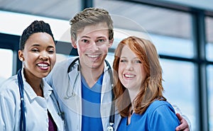 Their confidence inspires their patients confidence. Portrait of a team of confident young doctors working in a hospital