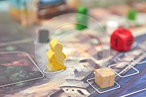 Themed Board games. colorful play figures with dice on Board. vertical view of the Board game close-up