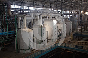 Theme industry and processing of agricultural crops. Equipment and machinery inside the old sugar factory of Soviet times