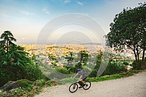 The theme of outdoor activities, sports lifestyle in nature. A man riding a mountain bike cross country on a mountain mountain