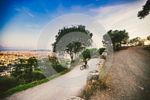 The theme of outdoor activities, sports lifestyle in nature. A man riding a mountain bike cross country on a mountain mountain
