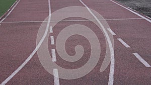 Theme sport and health. close-up of a running stadium cover, rubberized treadmill track. Rubber run around the road