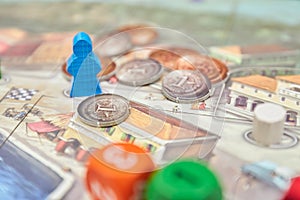 Themed Board games. colorful play figures with dice on Board. vertical view of the Board game close-up