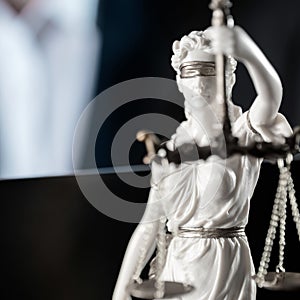 Themis figurine.  Wooden judge`s gavel. The criminal law.