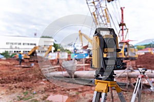 Theodolite equipment  of Surveyor builder engineer during surveying work in construction site