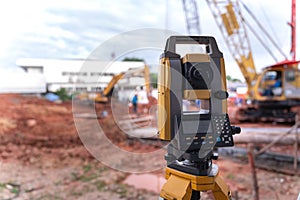 Theodolite equipment  of Surveyor builder engineer during surveying work in construction site