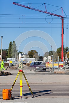 Theodolite on a tripod at the construction site