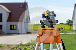 Theodolite on tripod on yard