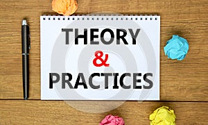 Theory and practice symbol. Words `Theory and practice` on white note on beautiful wooden table, colored paper, black metallic p