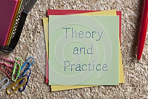 Theory and Practice written on a note photo