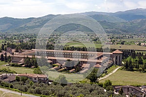 Ther valley with the cloister of the Charterhouse of Padula.