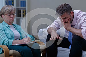 Therapist analysing problem of patient