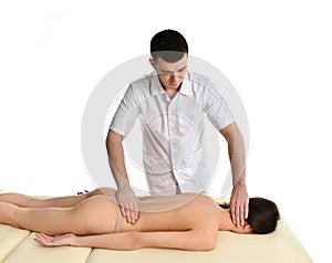 Therapist doctor examining his patient stomach or making abdomen massage isolated on white