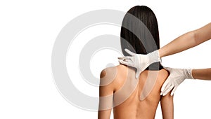 Therapist doctor hands in medical gloves doing healing physiotherapy treatment on woman neck spine massage