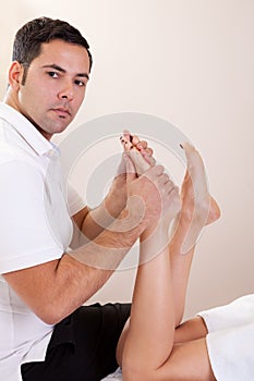 Therapist doing foot massage