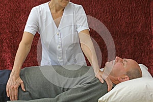 Therapist giving Polarity Therapy Treatment