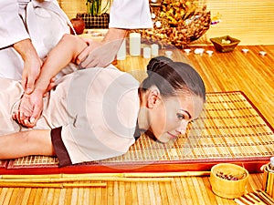 Therapist giving stretching massage to woman.