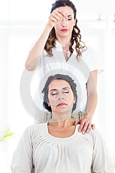 Therapist hypnotizing her patient