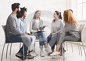 Therapist speaking to rehab group at therapy session