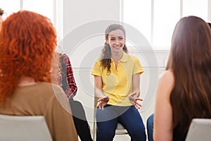 Therapist talking with a group at therapy session