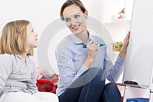 Therapist working with ADHD girl