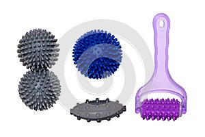 Therapy and fitness equipment. Closeup of spiky massage balls and rollers for health therapy isolated on a white background