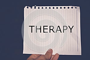 Therapy word written on white paper, health concept background