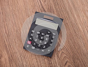 There is a blue calculator on the desk