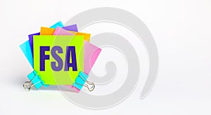 There are bright multi-colored stickers with the text FSA Flexible Spending Account. Copy space