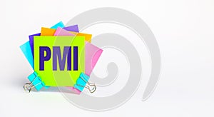 There are bright multi-colored stickers with the text PMI Project Management Institute on a white background. Copy space