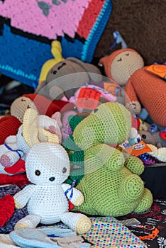 there are a bunch of crocheted toys on the couch