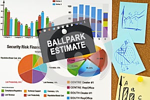 There are business charts, sticky notes and black paper with the inscription on the board - BALLPARK ESTIMATE