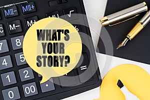 There is a calculator, a pen, a marker and a sticker with the inscription - WHAT S YOUR STORY