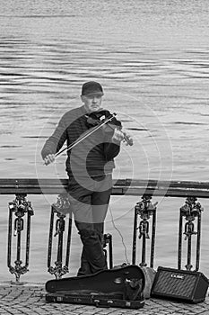 Street musician in a park in Bucharest