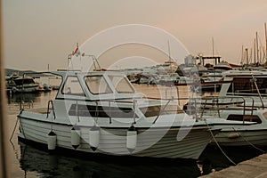 There are many yachts, boats and ships at sea. Marina at sunset