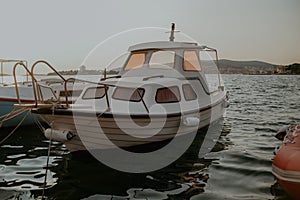 There are many yachts, boats and ships at sea. Marina at sunset