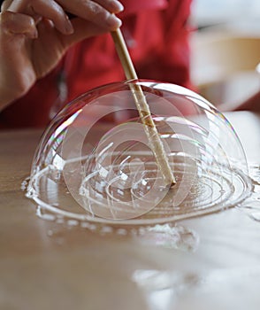 Making soap bubbles on a table