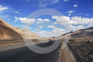 There is a newly built flat asphalt road at the foot of the magnificent, beautiful and charming mountain