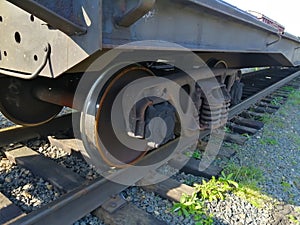 Old, rusty wagon wheels with spring and brakes