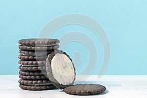 There\'s a stack of chocolate chip cookies on the table