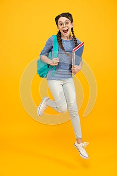 There is time for study and fun. Happy kid jump yellow background. Enjoying holidays. School holidays. Day out. Summer