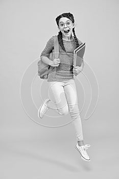 There is time for study and fun. Happy kid jump yellow background. Enjoying holidays. School holidays. Day out. Summer