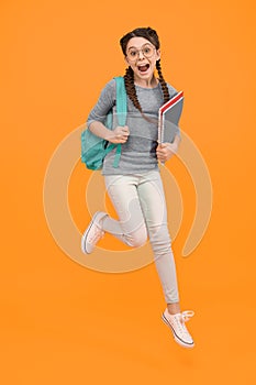 There is time for study and fun. Happy kid jump yellow background. Enjoying holidays. School holidays. Day out. Summer