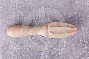 A wooden squeezer on the table