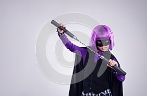 Theres a new villain in town. A studio shot of a confident little girl playing dress-up.