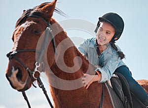 Theres no better adventure than riding a horse. an adorable little girl riding a horse.