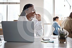 Theres no better feeling than this. a young businesswoman using a headset and laptop in a modern office.