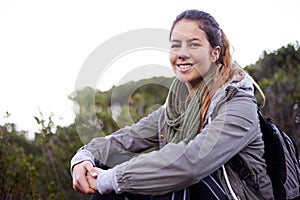 Theres no better place. Portrait of an attractive young woman taking a break while on a hike.